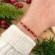 bransoletka na święta na sznurku z kamieni naturalnych karneol z gwiazdką na ręce