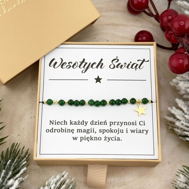 zielona bransoletka na sznurku z złotą zawieszką gwiazdy w pudełku prezentowym
