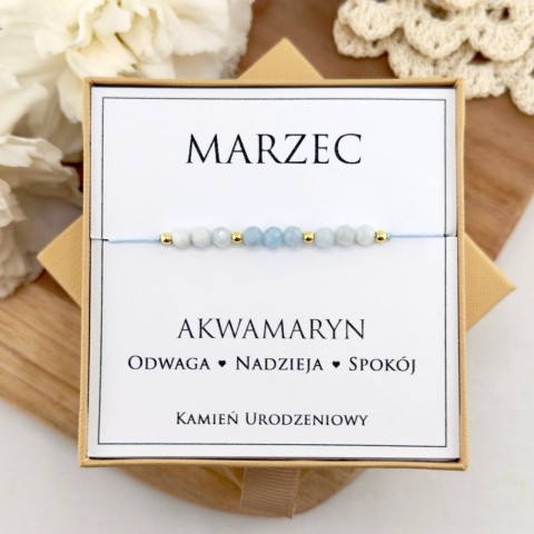 jasnoniebieska bransoletka urodzinowa marzec z kamienia akwamarynu na sznurku