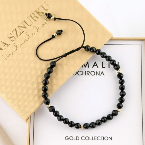 złota bransoletka z czarnego turmalinu na sznurku ze złotem 585 pełna