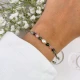 bransoletka znak zodiaku byk z perłą i kamieni na dłoni
