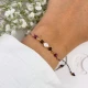 bransoletka zodiakalna lew z perłą na dłoni