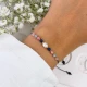 bransoletka znak zodiaku waga z perłą i kamieni na dłoni